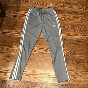 Adidas Kids Tiro soccer pant in light gray with white stripes. Size L (13-14)